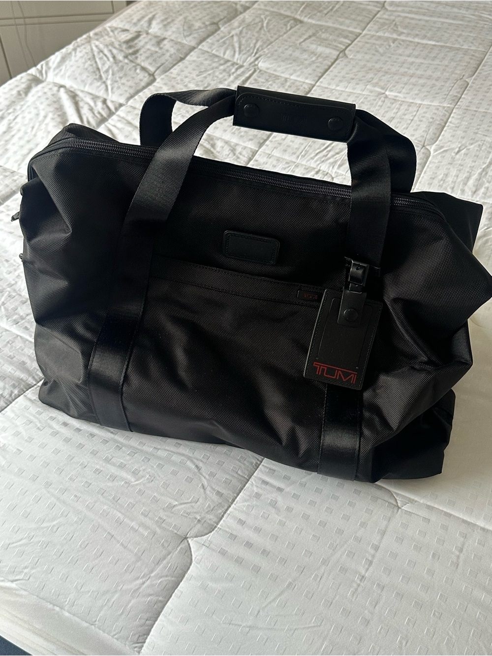 Tumi Black Nylon Weekend Duffel with Front Pocket, Trolley Sleeve & Luggage Tag